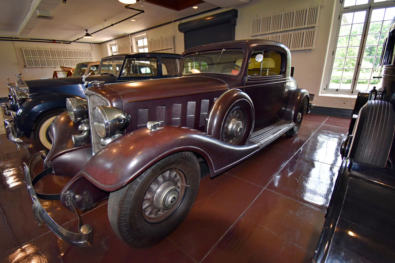 A 1933 Buick Coupe Model 866 is parked inside the Chauffeur's Garage.